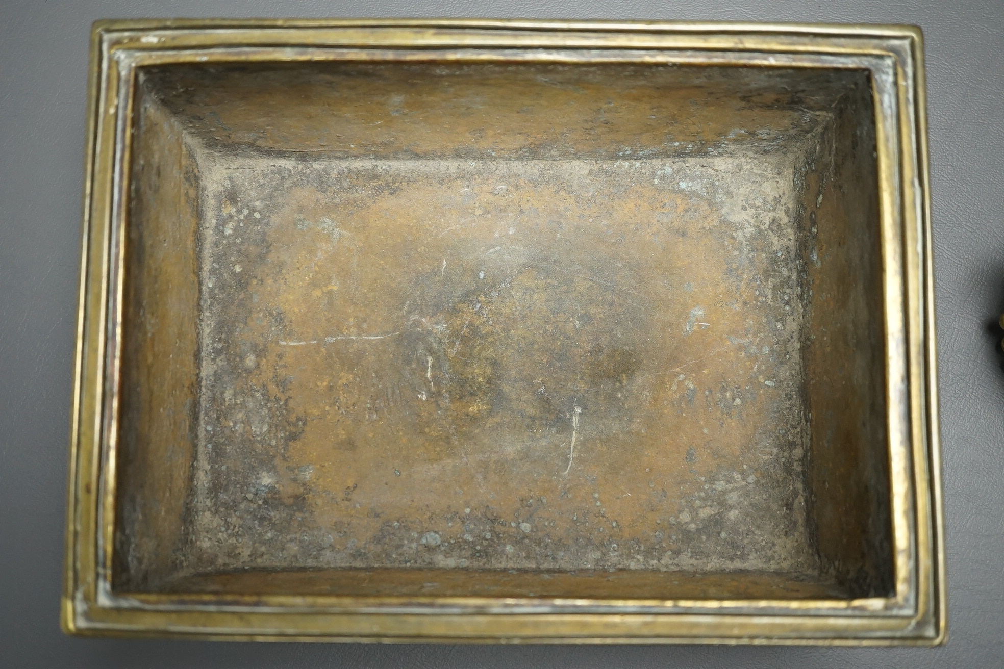 A large Chinese bronze rectangular censer and cover, Xuande seal mark, and a ‘plum blossom and chilong’ bronze censer, both 19th century